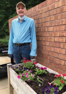 male resident gardening